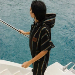 Slowtide Baja Stripe Hooded Towel Change Robe / Poncho -Surf Sales Shop 45967 202320Slowtide20Baja20Stripe20Hooded20Towel20Change20Robe2020Poncho20ST11520 20Black20Lifestyle203.2000x2000